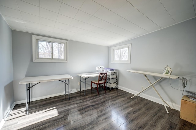 office featuring lofted ceiling, visible vents, baseboards, and wood finished floors