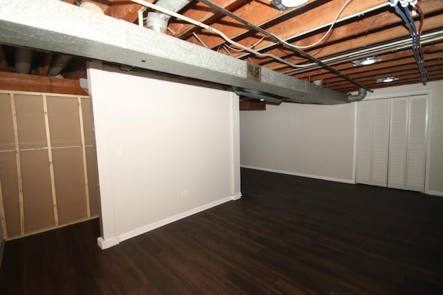 finished basement with wood finished floors and baseboards