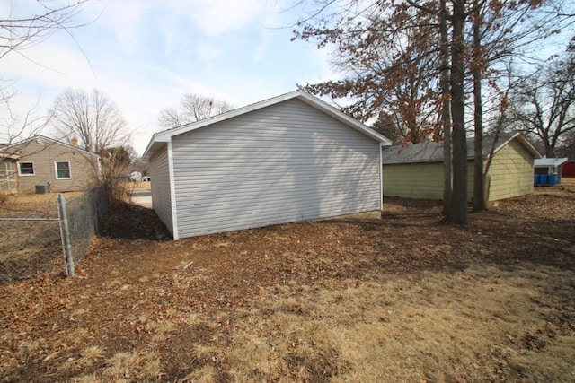 view of home's exterior with fence