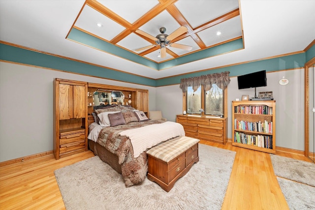 bedroom featuring baseboards, coffered ceiling, ceiling fan, wood finished floors, and crown molding