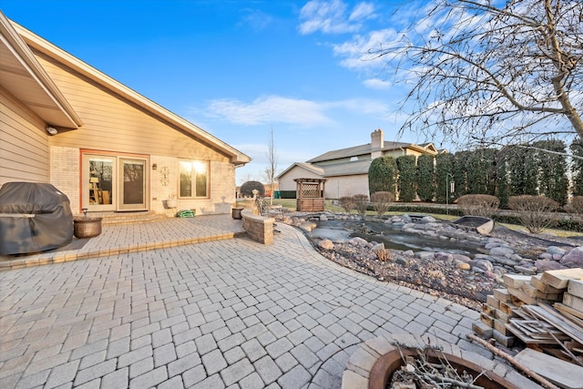 view of patio featuring entry steps and area for grilling