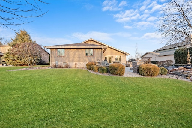 view of front of property featuring a front lawn and a patio area