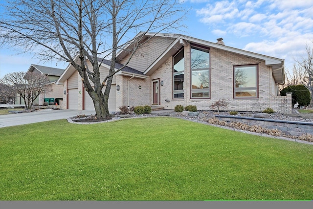 mid-century home with brick siding, a chimney, a front yard, a garage, and driveway