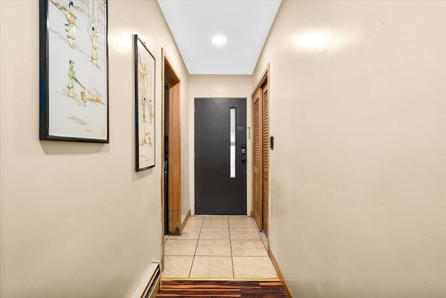 corridor featuring light tile patterned floors