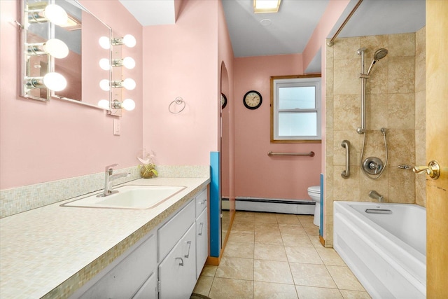 full bathroom with a baseboard radiator, toilet, vanity,  shower combination, and tile patterned floors