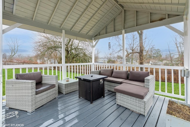 wooden terrace featuring an outdoor hangout area