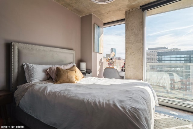 bedroom featuring a city view