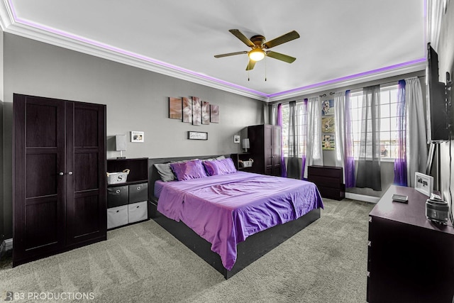 bedroom featuring light carpet, ceiling fan, and ornamental molding