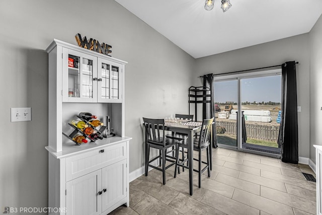 dining area featuring visible vents and baseboards