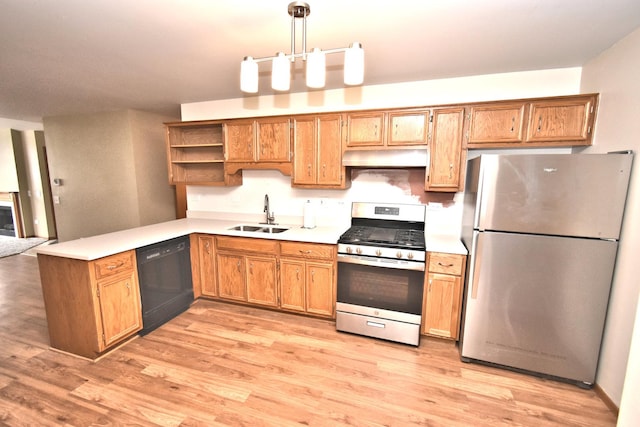 kitchen with under cabinet range hood, a sink, light countertops, appliances with stainless steel finishes, and open shelves