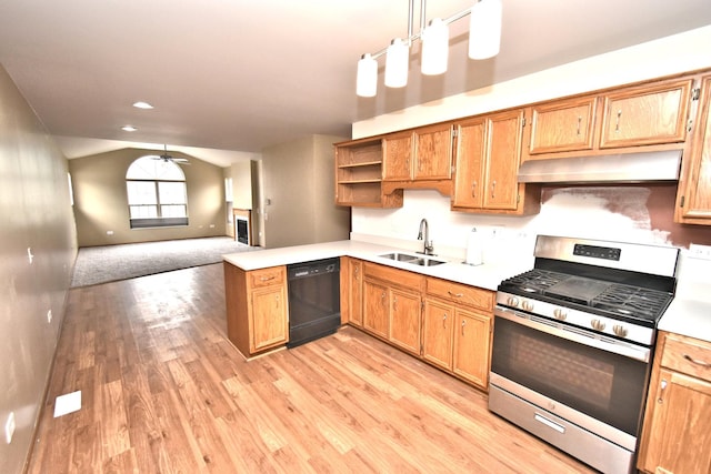 kitchen featuring dishwasher, gas range, vaulted ceiling, under cabinet range hood, and a sink