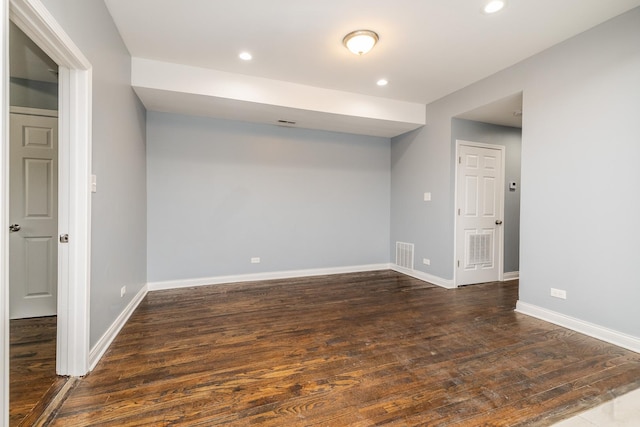 spare room with recessed lighting, visible vents, baseboards, and wood finished floors