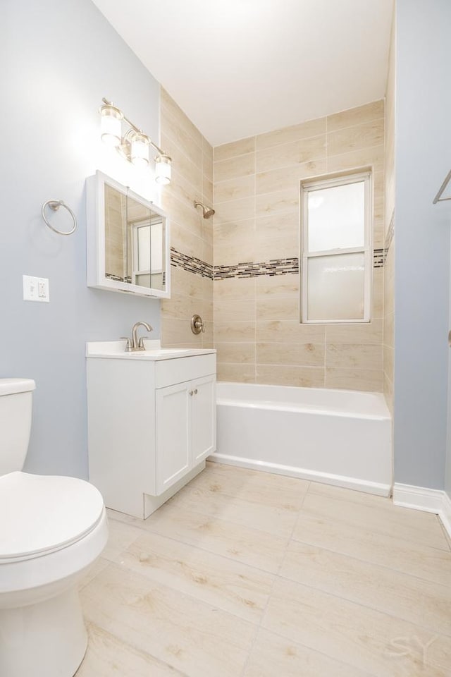 full bath featuring shower / washtub combination, vanity, toilet, and baseboards