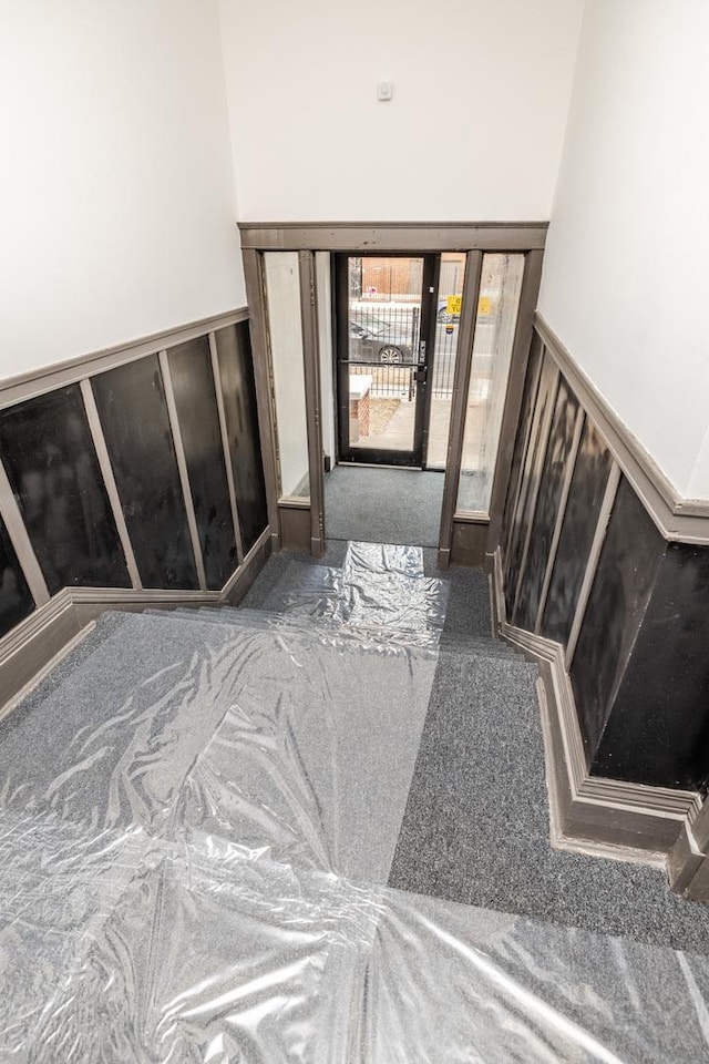 foyer featuring a wainscoted wall