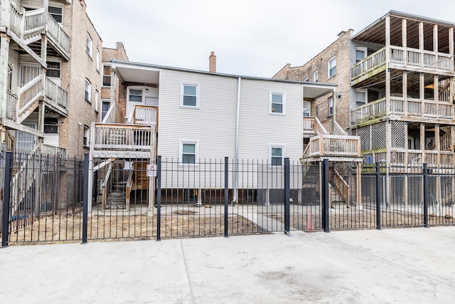 exterior space with fence and a chimney