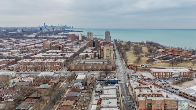 bird's eye view featuring a water view and a city view