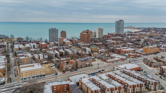 drone / aerial view with a city view and a water view