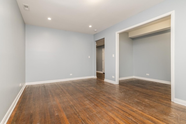 unfurnished bedroom featuring dark wood-style floors, recessed lighting, visible vents, and baseboards