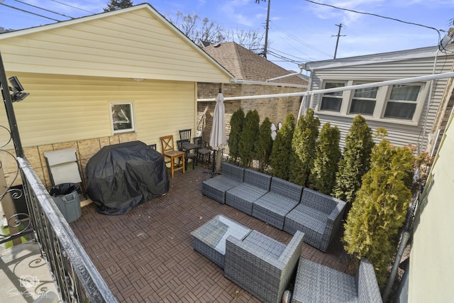 view of patio featuring outdoor lounge area and a grill