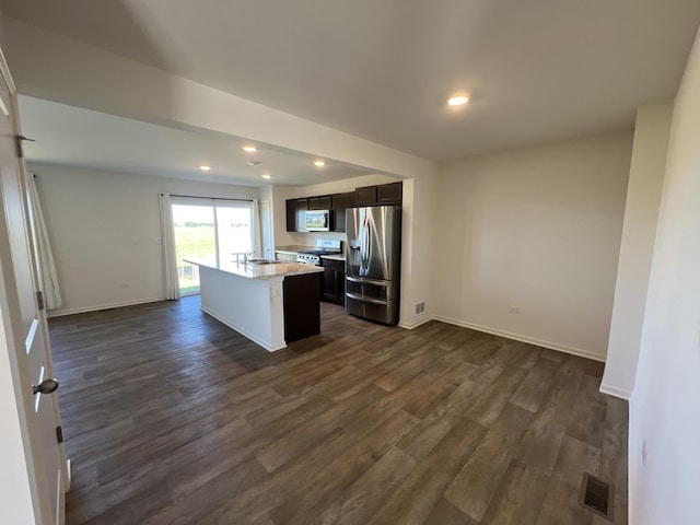 kitchen with dark wood-type flooring, recessed lighting, visible vents, and stainless steel appliances