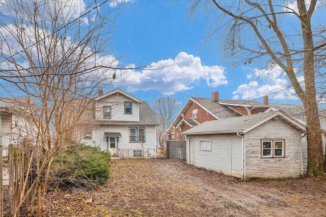 back of house with fence