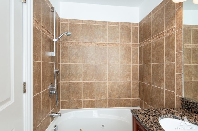 bathroom featuring a combined bath / shower with jetted tub and vanity