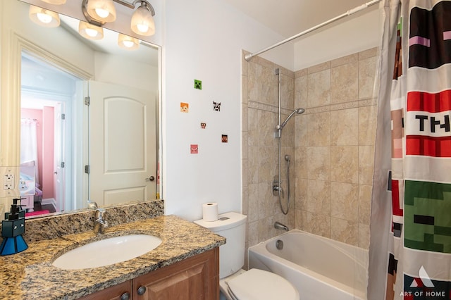 full bathroom featuring shower / bath combo, vanity, and toilet