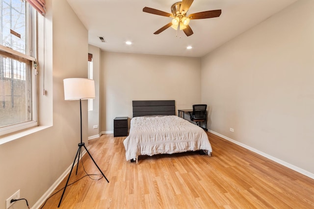 bedroom featuring recessed lighting, visible vents, baseboards, and wood finished floors