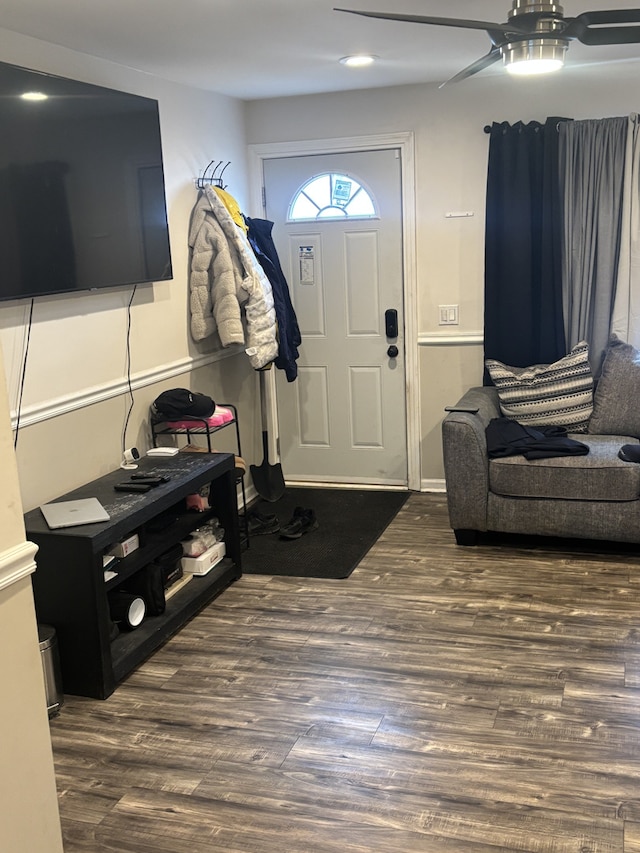 foyer entrance with ceiling fan and wood finished floors