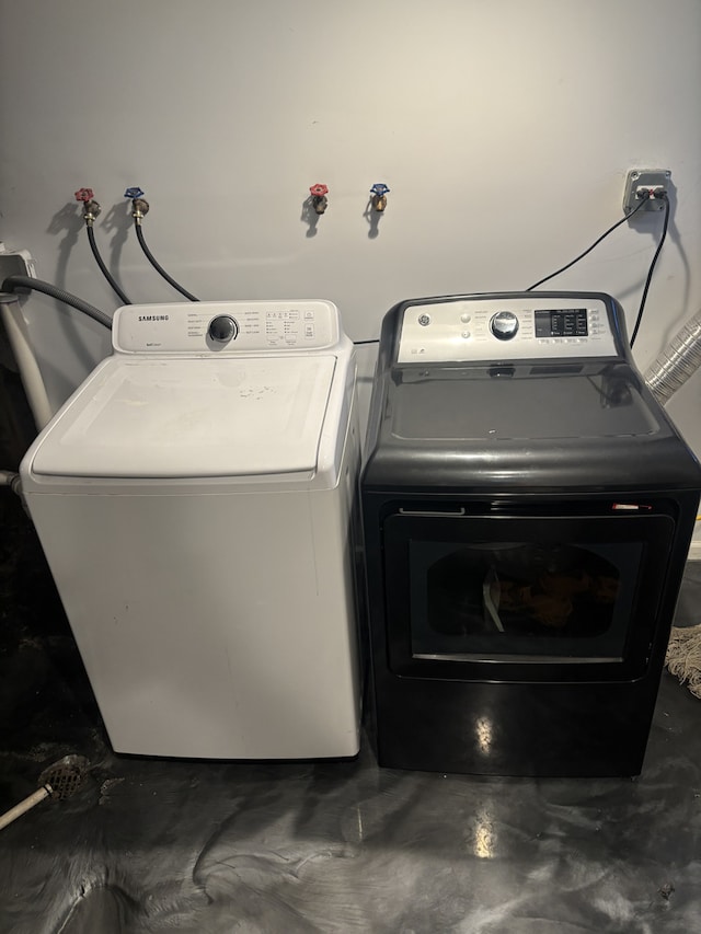 laundry room with separate washer and dryer