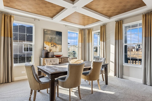 carpeted dining space featuring beamed ceiling, baseboards, and coffered ceiling