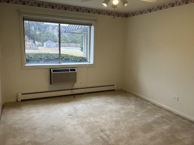 unfurnished room with a ceiling fan, a baseboard radiator, an AC wall unit, and light carpet