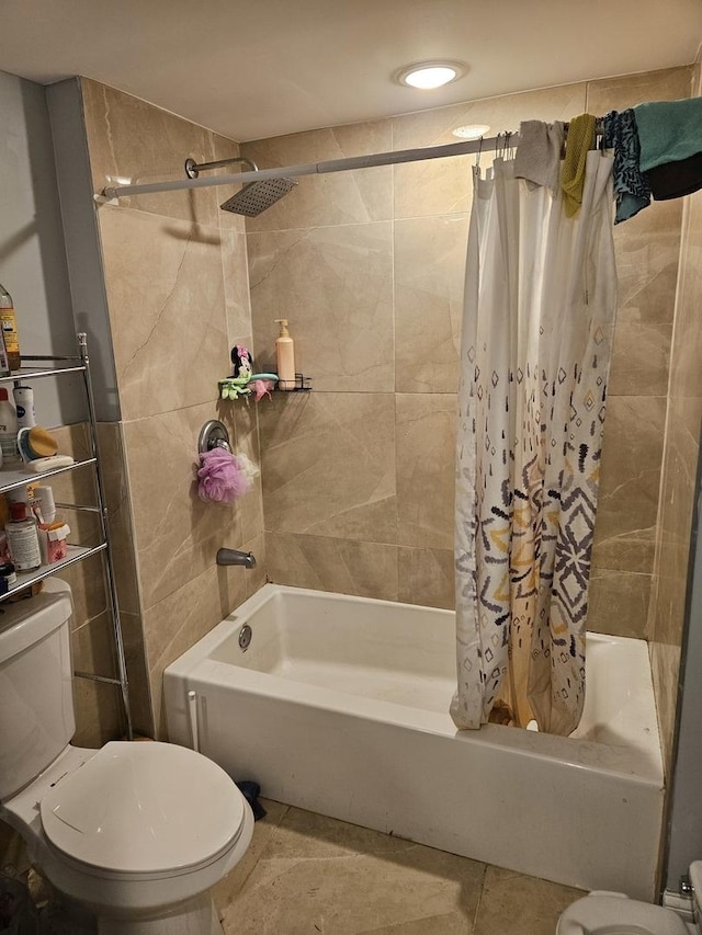 bathroom with tile patterned flooring, toilet, and shower / bath combo with shower curtain