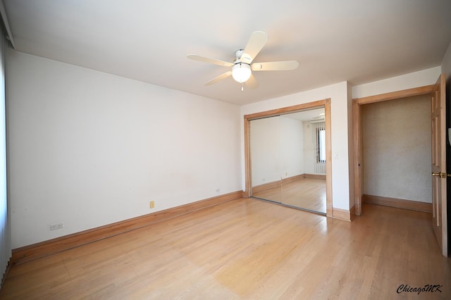 unfurnished bedroom featuring a closet, light wood-type flooring, a ceiling fan, and baseboards