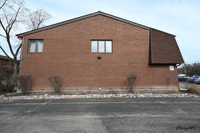 view of home's exterior featuring brick siding