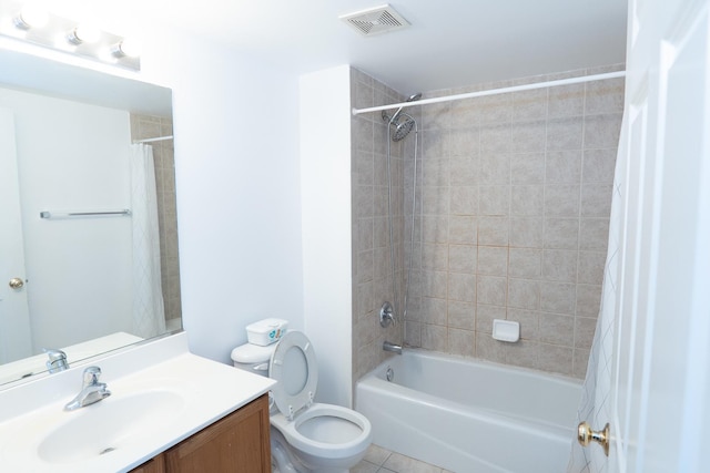 full bathroom with visible vents, toilet, shower / tub combo, vanity, and tile patterned floors