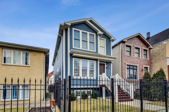 traditional home featuring a fenced front yard