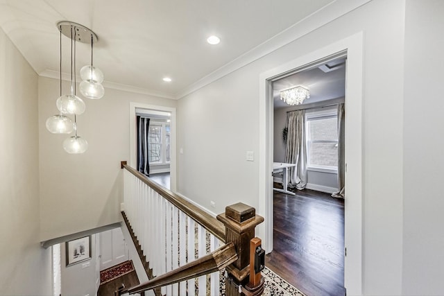 hallway with baseboards, dark wood-style floors, crown molding, an upstairs landing, and recessed lighting