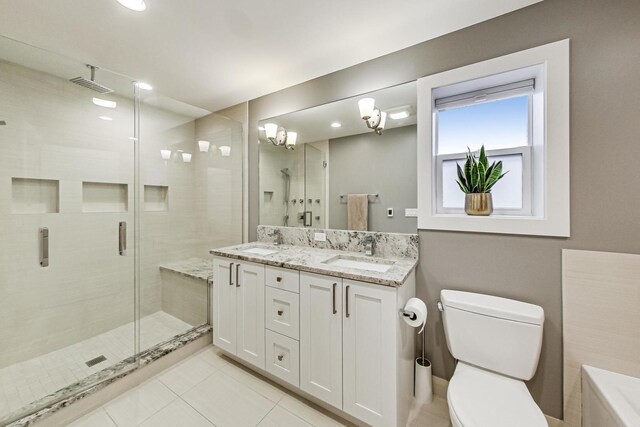 full bathroom featuring visible vents, a stall shower, a sink, and toilet