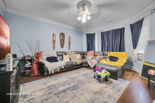 living room with ornamental molding, visible vents, ceiling fan, and wood finished floors