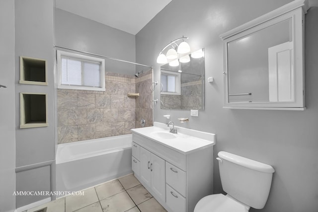 bathroom featuring tub / shower combination, vanity, toilet, and tile patterned floors