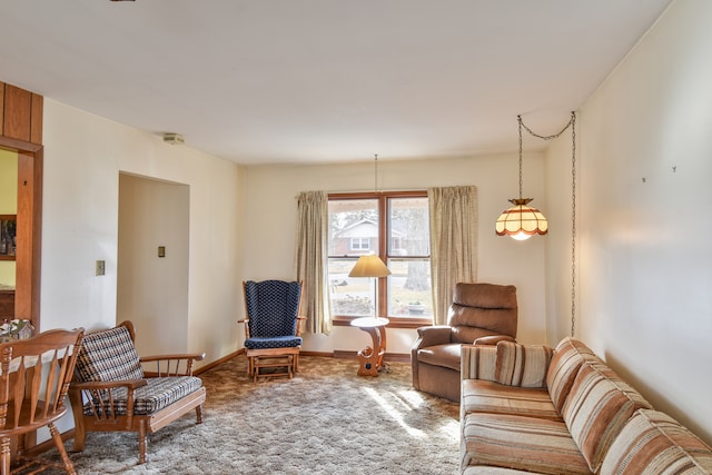 living area with carpet and baseboards