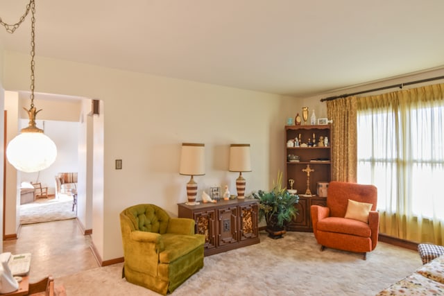 living area with a wealth of natural light and baseboards