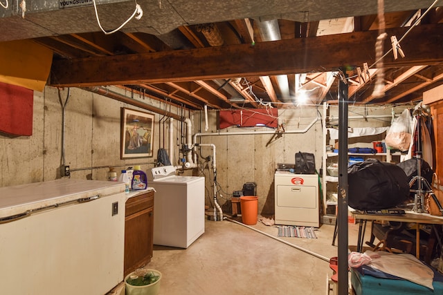 unfinished basement featuring washer and clothes dryer