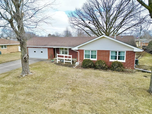 single story home featuring an attached garage, a front lawn, concrete driveway, and brick siding