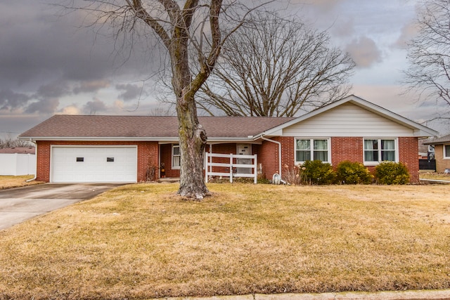 ranch-style house with a garage, driveway, brick siding, and a front lawn