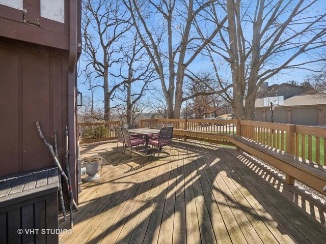 deck with outdoor dining area