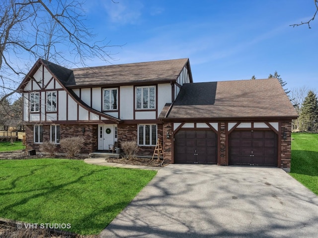 tudor-style house with brick siding, stucco siding, a garage, and a front yard