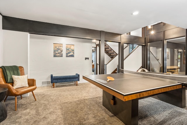 recreation room featuring carpet flooring and visible vents