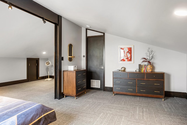 bedroom with visible vents, baseboards, light colored carpet, and vaulted ceiling